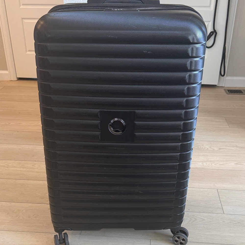 Black Delsey Paris Hardshell Rolling Suitcase
